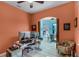 Spacious home office with multiple monitors, stylish decor, and an open view to the dining and living areas at 1394 Oakmont Dr, Winter Haven, FL 33884