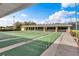 Community shuffleboard court with multiple lanes available for residents and guests at 1394 Oakmont Dr, Winter Haven, FL 33884