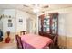 Traditional dining room with wood table, chairs, and a large china cabinet in a cozy setting at 145 Jana Cir, Auburndale, FL 33823