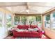 Bright sun room filled with light, offering views of the outdoors and comfortable seating at 145 Jana Cir, Auburndale, FL 33823