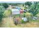 Expansive property with multiple structures, storage units, and lush greenery at 14810 Brahma Rd, Polk City, FL 33868