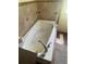 An inviting white soaking tub featuring whirlpool jets and chrome fixtures, perfect for relaxation at 14810 Brahma Rd, Polk City, FL 33868