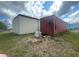 An exterior shot of buildings including a metal storage container at 14810 Brahma Rd, Polk City, FL 33868