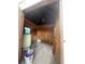 Plywood interior with water heater and storage buckets at 14810 Brahma Rd, Polk City, FL 33868