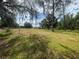 Expansive acreage with mature trees, perfect for outdoor living at 14810 Brahma Rd, Polk City, FL 33868
