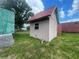An exterior shot of a shed in a grassy lot against a partly cloudy sky at 14810 Brahma Rd, Polk City, FL 33868