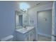 This bathroom includes a vanity with a white marble top at 1517 Leamington Ln, Winter Haven, FL 33884