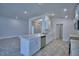 Kitchen with island, stainless steel appliances, and stone countertops at 1517 Leamington Ln, Winter Haven, FL 33884