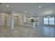 Open-concept living space with white cabinets, an island, and recessed lighting at 1517 Leamington Ln, Winter Haven, FL 33884