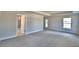 Bright and airy bedroom featuring neutral walls, plush carpet, and recessed lighting at 1517 Leamington Ln, Winter Haven, FL 33884