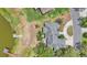 Wide aerial shot showcasing the home's serene lakeside setting and outdoor space at 1854 Sherwood Lakes Blvd, Lakeland, FL 33809