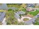 Aerial view of a home near a tranquil lake and beautifully landscaped grounds in a residential neighborhood at 1854 Sherwood Lakes Blvd, Lakeland, FL 33809