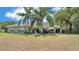 Lovely backyard with patio and large trees, ideal for outdoor enjoyment and relaxation at 1854 Sherwood Lakes Blvd, Lakeland, FL 33809