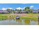 Lush backyard features a private dock overlooking a serene lake, perfect for enjoying waterfront living at 1854 Sherwood Lakes Blvd, Lakeland, FL 33809