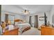 Comfortable bedroom with wooden furniture, ceiling fan, and bright windows at 1854 Sherwood Lakes Blvd, Lakeland, FL 33809