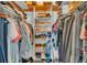 Organized walk-in closet with shelves, hanging rods and plenty of storage for clothes and accessories at 1854 Sherwood Lakes Blvd, Lakeland, FL 33809