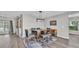 Dining room featuring a modern light fixture and a dining table with seating for six at 1854 Sherwood Lakes Blvd, Lakeland, FL 33809