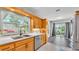Kitchen with oak cabinets, stainless appliances and a view to the outside patio at 1854 Sherwood Lakes Blvd, Lakeland, FL 33809