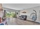 Inviting living room with a sliding glass door, fireplace, and stylish hanging chair at 1854 Sherwood Lakes Blvd, Lakeland, FL 33809