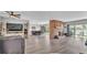 Open-concept living room flows into dining area with a fireplace, offering great space for gatherings at 1854 Sherwood Lakes Blvd, Lakeland, FL 33809