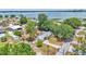 Aerial view of a residential home with a backyard trampoline, near a lake at 1965 Avenue F Sw, Winter Haven, FL 33880