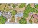 Overhead view of a home with a trampoline, set among mature trees at 1965 Avenue F Sw, Winter Haven, FL 33880