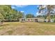 Large backyard with ample space, featuring a patio area and room for outdoor activities and relaxation at 1965 Avenue F Sw, Winter Haven, FL 33880