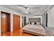Bedroom with hardwood floors, ample closet space, and stylish decor at 1965 Avenue F Sw, Winter Haven, FL 33880