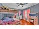 Charming bedroom with bunk beds, colorful decor, and plenty of natural light at 1965 Avenue F Sw, Winter Haven, FL 33880