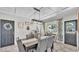 Bright dining room with a neutral color scheme, stylish decor, and access to multiple entryways for easy flow at 1965 Avenue F Sw, Winter Haven, FL 33880