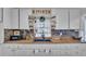 Bright kitchen featuring ample counter space, white cabinets, and modern fixtures for a delightful cooking experience at 1965 Avenue F Sw, Winter Haven, FL 33880