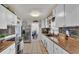 Renovated kitchen showcasing stainless steel appliances, decorative accents, and functional design for everyday convenience at 1965 Avenue F Sw, Winter Haven, FL 33880
