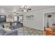 Spacious living room featuring hardwood floors, a large area rug, and comfortable seating arrangement at 1965 Avenue F Sw, Winter Haven, FL 33880