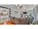 Open living space showcasing hardwood floors that flow into a well-equipped kitchen at 1965 Avenue F Sw, Winter Haven, FL 33880