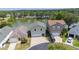 Aerial view of waterfront homes featuring well-maintained lawns and a tranquil lake setting at 2015 Hatteras Pt, Lakeland, FL 33813