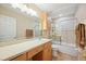 Bright bathroom featuring vanity with sink, and shower with glass enclosure at 2015 Hatteras Pt, Lakeland, FL 33813