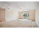 Bright bedroom with sliding door to a patio with a lake view at 2015 Hatteras Pt, Lakeland, FL 33813