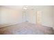 Spacious bedroom with neutral carpet, ceiling fan, and access to the ensuite bathroom at 2015 Hatteras Pt, Lakeland, FL 33813