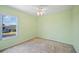 Bedroom with window and neutral carpet; a blank canvas ready for your personal touch at 2015 Hatteras Pt, Lakeland, FL 33813