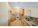 Well-lit kitchen features granite countertops and ample cabinet space at 2015 Hatteras Pt, Lakeland, FL 33813