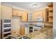 Kitchen features granite countertops, appliances, and ample cabinet space at 2015 Hatteras Pt, Lakeland, FL 33813