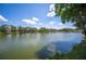 Expansive lake view showcasing serene water and lush greenery on the shoreline at 2015 Hatteras Pt, Lakeland, FL 33813