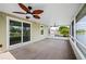 Spacious screened patio with fan and water view at 2015 Hatteras Pt, Lakeland, FL 33813