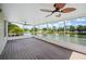 Spacious screened in patio with fans overlooking a lake at 2015 Hatteras Pt, Lakeland, FL 33813