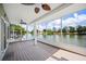 Relaxing porch with scenic water views, ceiling fans for comfort, and durable decking, ideal for outdoor living at 2015 Hatteras Pt, Lakeland, FL 33813