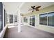 Spacious porch featuring an expansive water view, ceiling fans, durable decking, and ample natural light at 2015 Hatteras Pt, Lakeland, FL 33813