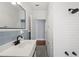 Updated bathroom featuring white subway tile, black fixtures, and light blue accent tiles at 202 W Hancock St, Lakeland, FL 33803