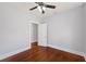 Bedroom features hardwood floors, natural light, and a convenient closet at 202 W Hancock St, Lakeland, FL 33803