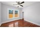 This bedroom has hardwood floors, natural light, and a spacious closet at 202 W Hancock St, Lakeland, FL 33803