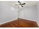 Bedroom showcasing hardwood floors, a ceiling fan, and closet for ample storage at 202 W Hancock St, Lakeland, FL 33803